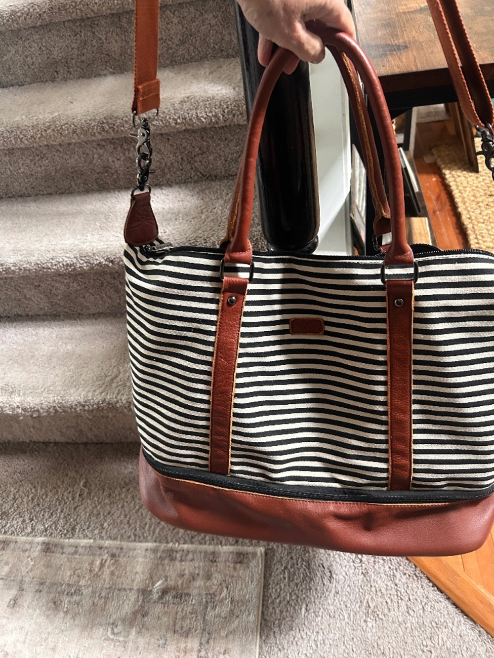 Striped Canvas weekender bag with brown faux leather trim.